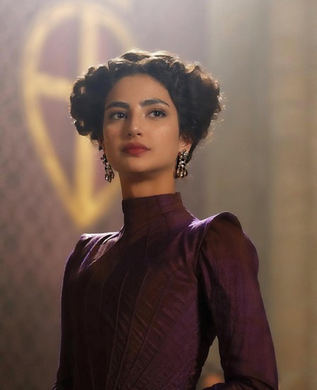 Medalion Rahimi posing for a photoshoot 